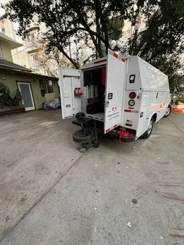 Magnet Plumbing service vehicle on-site for Grease Trap Cleaning in Fort Hancock
